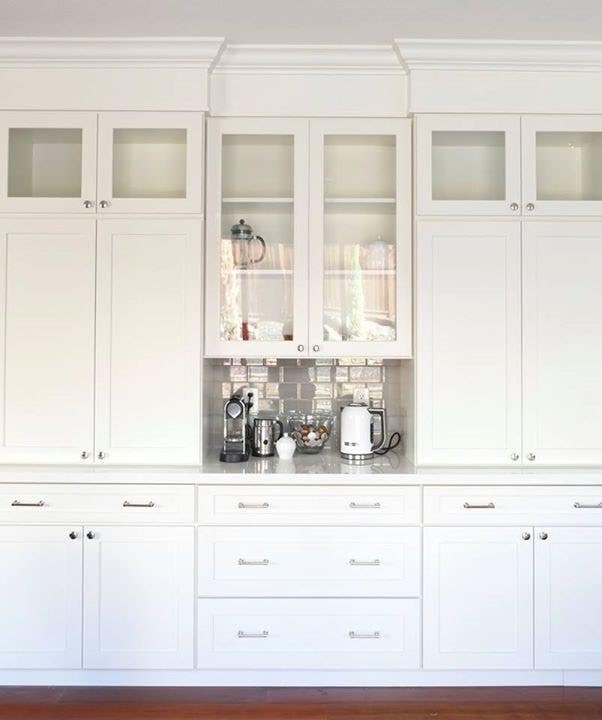 White shaker buffet kitchen cabinets with glass doors