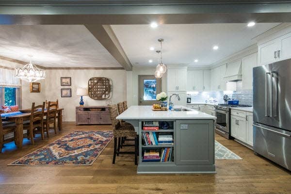 White kitchen island with counter supports