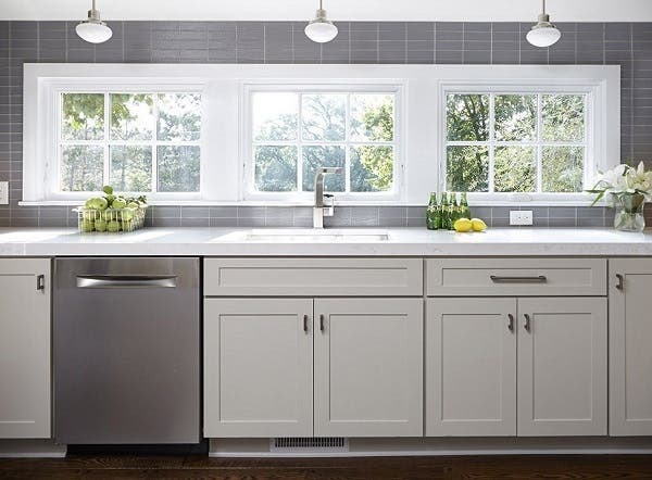 Bright, open and neat as a pin, the clean-up zone in this kitchen uses a strategic assortment of storage solutions to keep clutter out of sight. Bright, open and neat as a pin, the clean-up zone in this kitchen uses a strategic assortment of storage solutions to keep clutter out of sight.