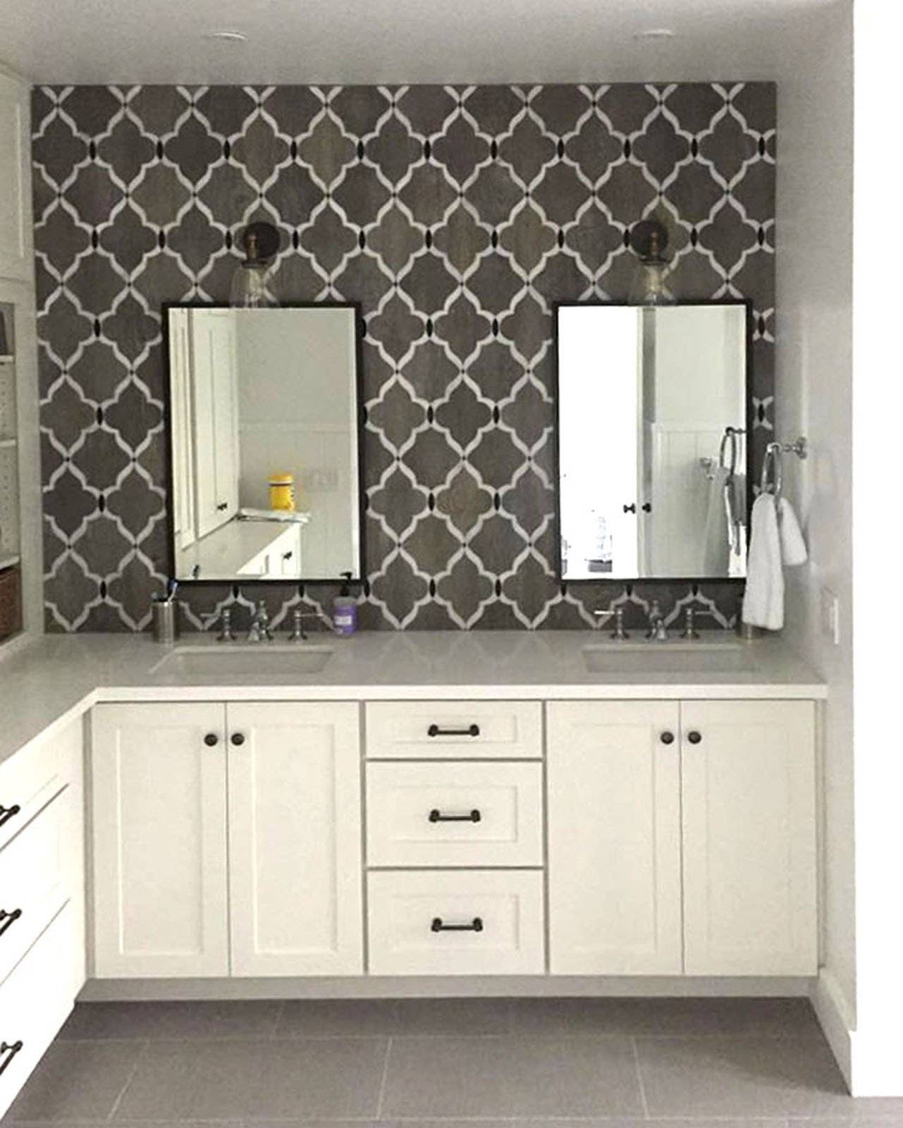 CliqStudios bath cabinets shown in Shaker White door style and finish