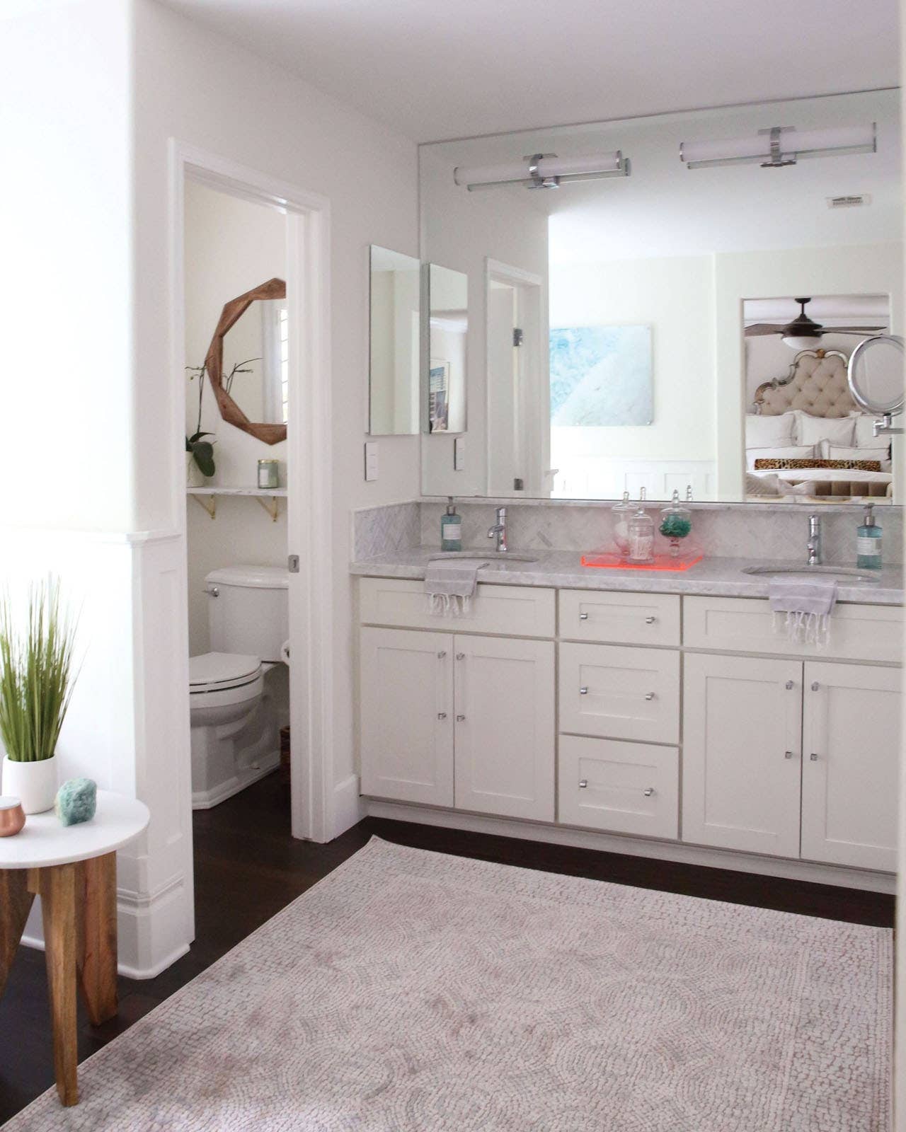 CliqStudios bath cabinets shown in Shaker White door style and finish