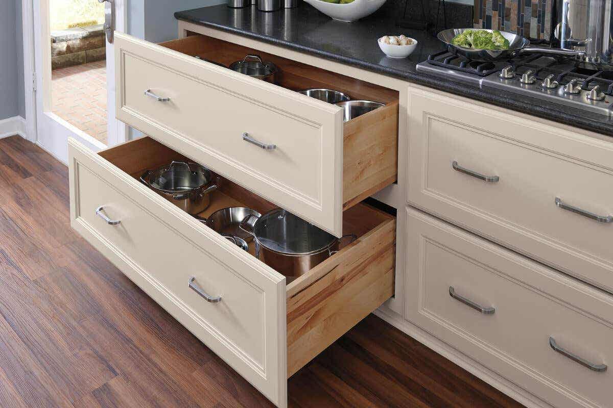 Popular Kitchen Island Upgrades to Consider Decorative cream cabinets with deep drawer storage for pots and pans