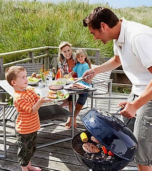 family grilling outside