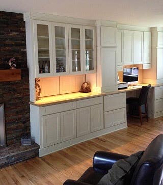 Library wall and computer workstation built from white shaker cabinets Library wall and computer workstation built from white shaker cabinets