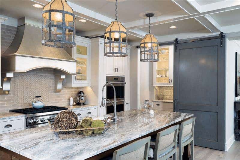 White inset kitchen design with brown island and white and brown granite countertops