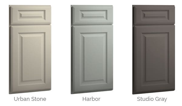 raised-panel cabinet fronts in three grays - light earth tone, cool blue and deep red-hued gray