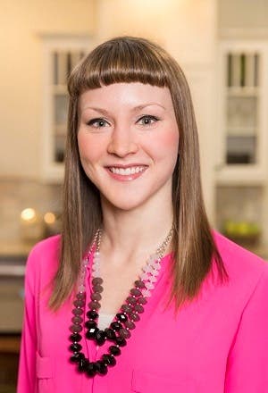 kitchen designer erin lubbe, young woman in pink suit has long har with bangs kitchen designer erin lubbe, young woman in pink suit has long har with bangs