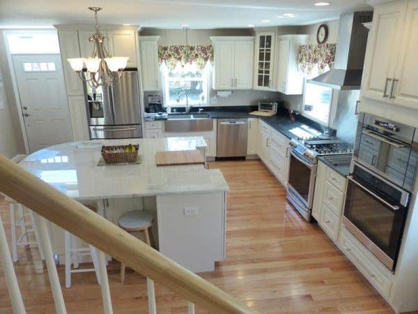 Cape Cod kitchen remodeling project features CliqStudios.com Decorative raised panel cabinets in painted White finish.