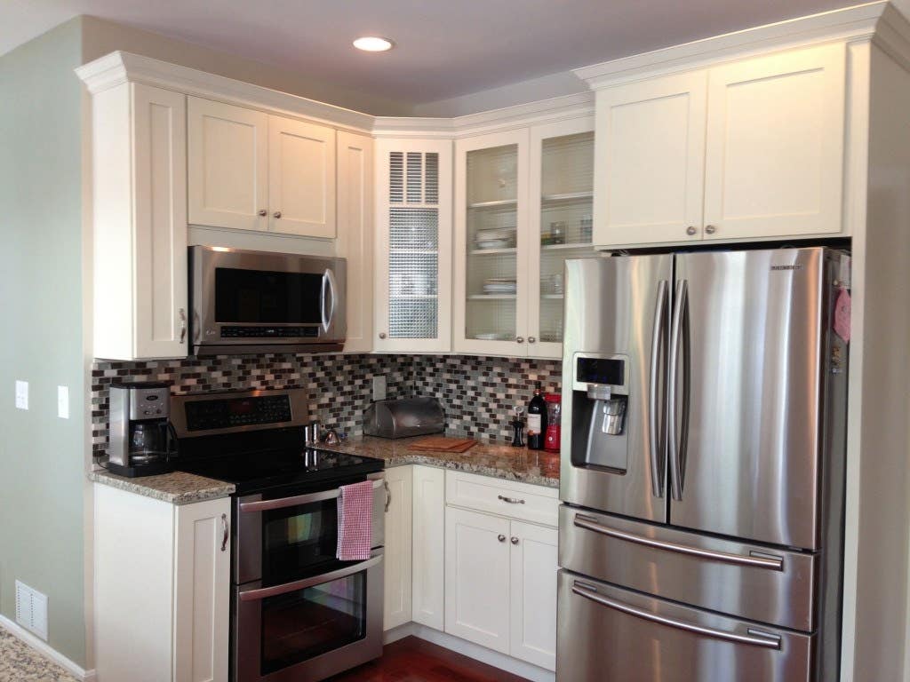 kitchen with white glass door cabinets