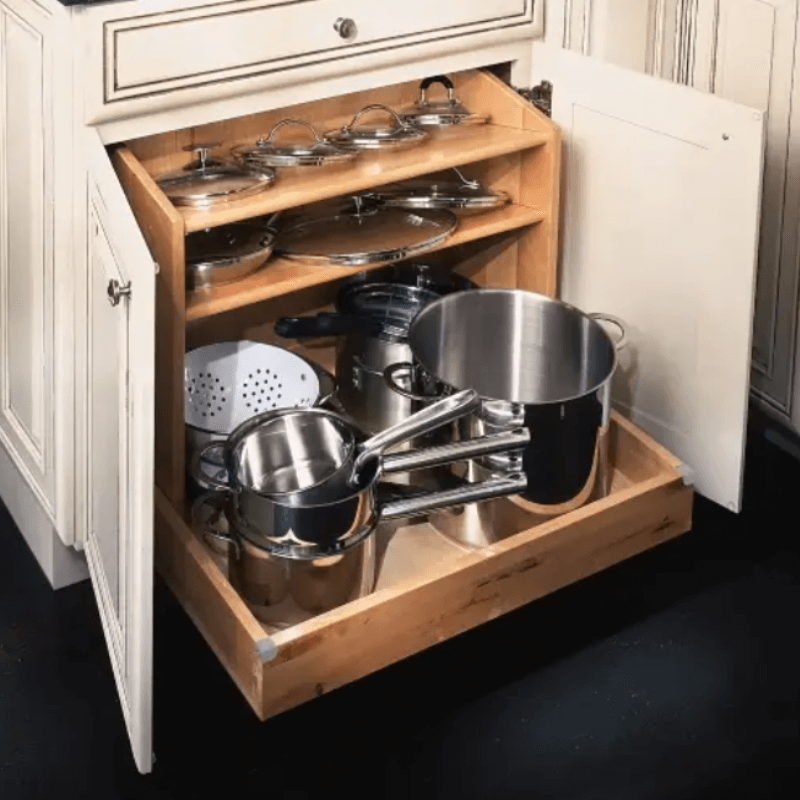 Pots and Pans Organizer Pull-out pots and pans organizer with storage for lids above.