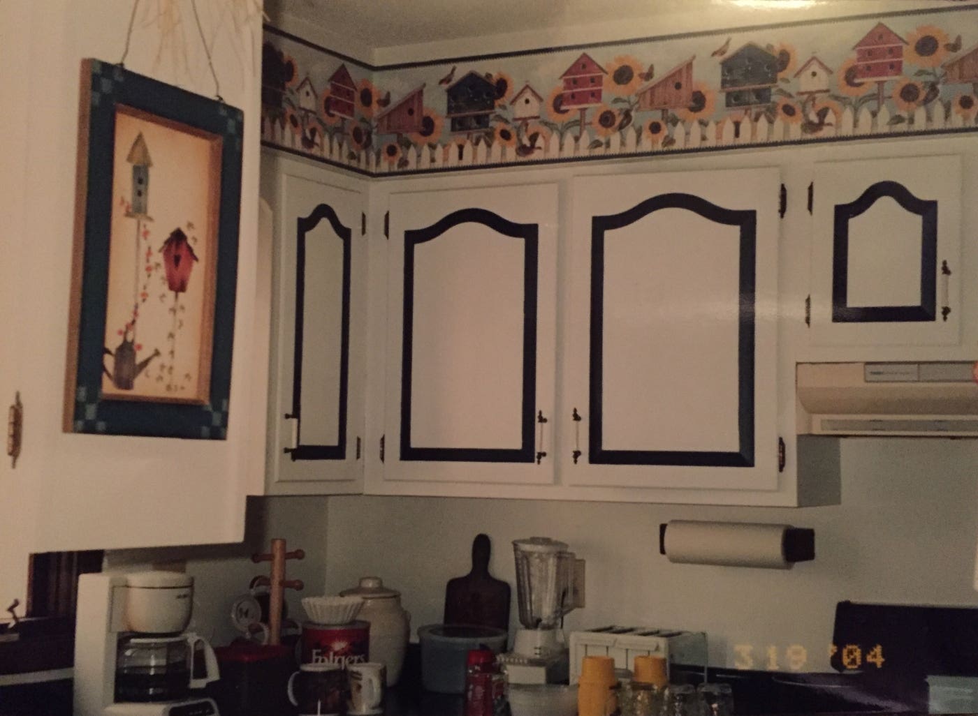 painted kitchen cabinets with cathedral doors in two-tone scheme with wallpaper trim painted kitchen cabinets with cathedral doors in two-tone scheme with wallpaper trim