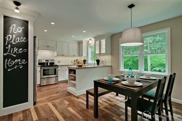 White kitchen with interesting wood flooring White kitchen with interesting wood flooring