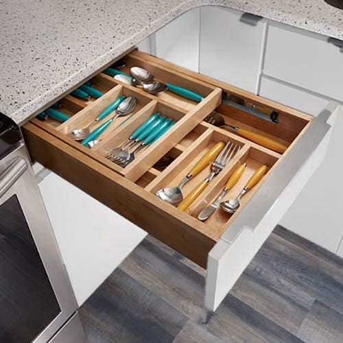 Tiered cutlery divider kitchen cabinet with painted white slab door style Tiered cutlery divider kitchen cabinet with painted white slab door style