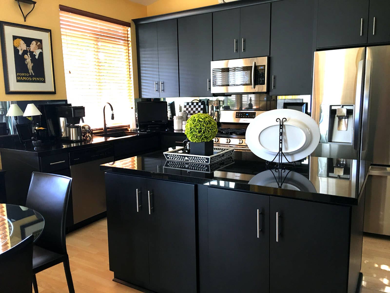 Beautiful black slab door style kitchen cabinets.