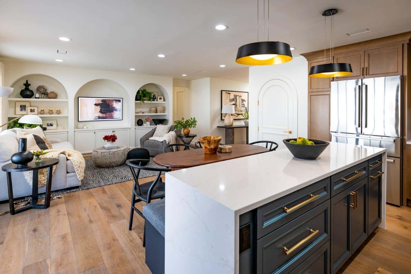 Decorative recessed door style kitchen design in light wood cabinets with indigo kitchen island