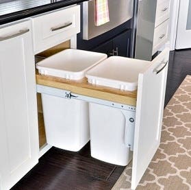 pull-out trash and recycling center in shaker white cabinets