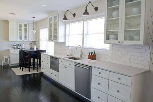 white kitchen cabinets with glass doors and white subway tile backsplash. white kitchen cabinets with glass doors and white subway tile backsplash.